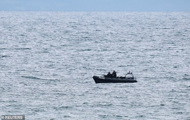 A police boat bobbing offshore