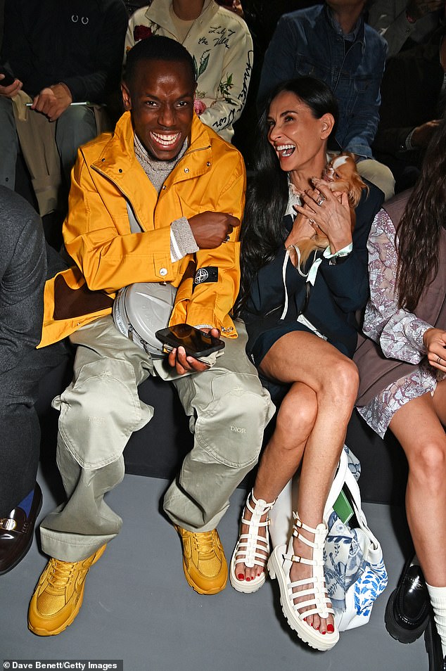 Demi Moore with actor Micheal Ward as they sat together on the front row of the Dior Homme show during Paris Men's Fashion Week last year