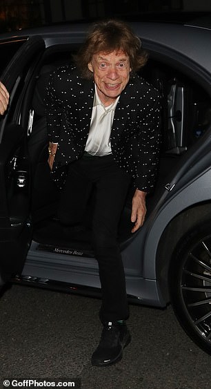 He appeared to be in jovial spirits as he flashed a huge smile while getting out of his car