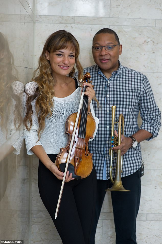 Ms Benedetti, 38, met celebrated jazz musician Wynton Marsalis, 63, (both pictured) more than 21 years ago in New York when she attended the American Academy of Achievement summit as a student-delegate
