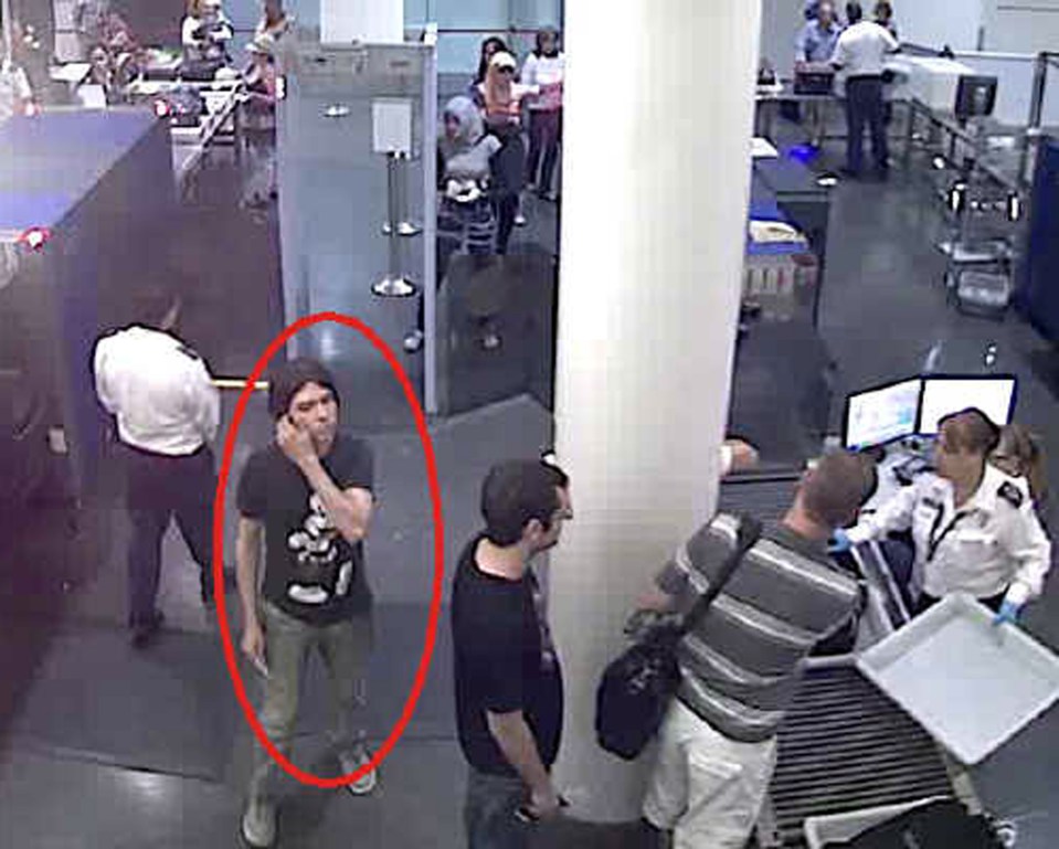 Surveillance image of Luka Rocco Magnotta at a security checkpoint.