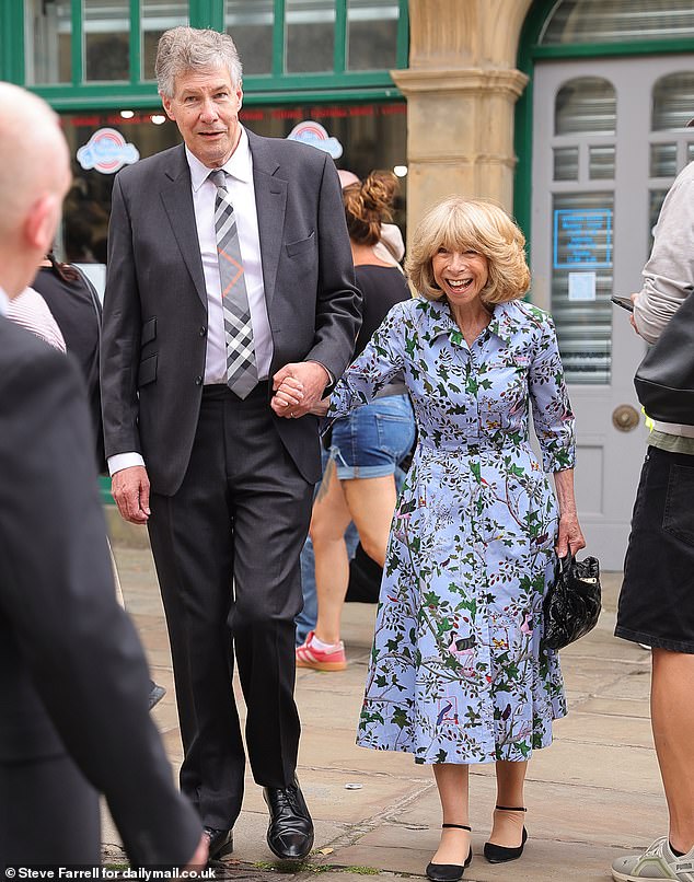 Helen Worth, who played Jack's on-screen mum Gail, beamed as she arrived with her partner Trevor Dawson