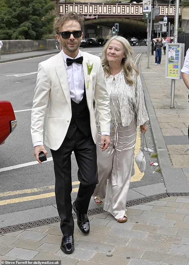 Jack's mother was dressed in a champagne satin co-ord