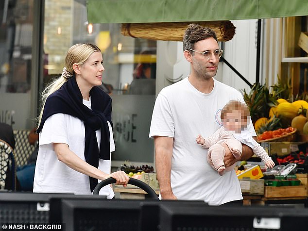 The former model cut a casual figure in a baggy white T-shirt and black trousers, with a sweatshirt wrapped around her shoulders