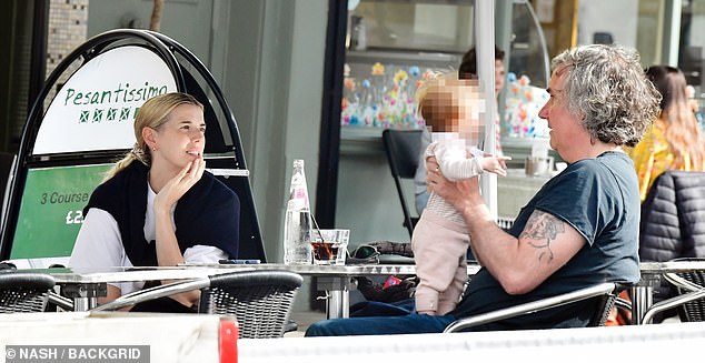They were accompanied by her friend, the British musician and composer Antony Genn, who appeared delighted to meet her new bundle of joy
