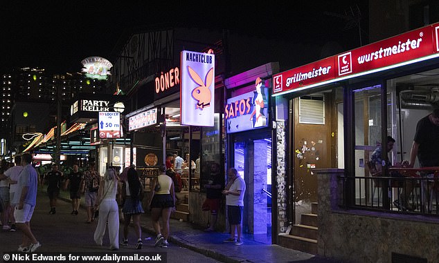 Pictured: 'Grillmeister' where Germans head to for Bratwurst and Currywurst after a night on the strip. Next door is a strip club entitled Safos, with a German sign reading 'Nachtclub'. Beside it sits a German doner kebab shop, and beyond it a big German bar 'Bierkonig'