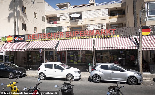 Pictured: One of many Deutsch supermarkets with the German flag on both ends. The stores sell German snacks, books and t-shirts