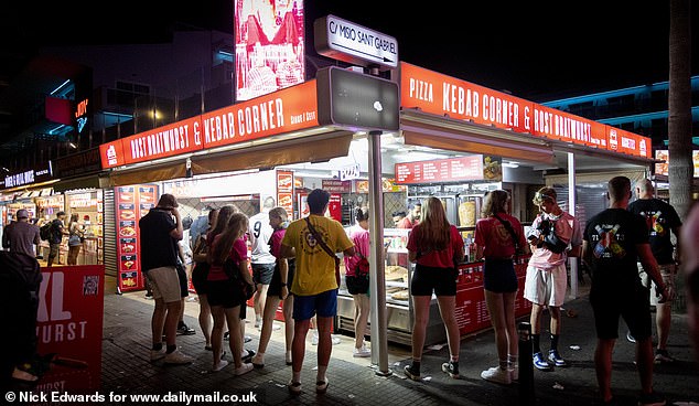 Queues of Germans lining up for traditional bratwurst at the end of their night