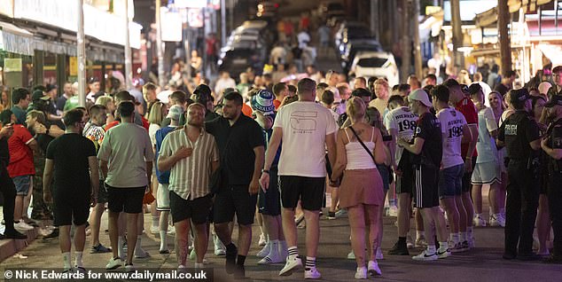 One of the streets with lines of German bars is seen packed on a Monday night