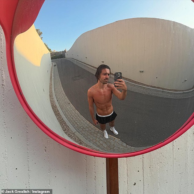 Jack also snapped a mirror selfie while out for a spot of exercise as he posed shirtless again in black gym shorts