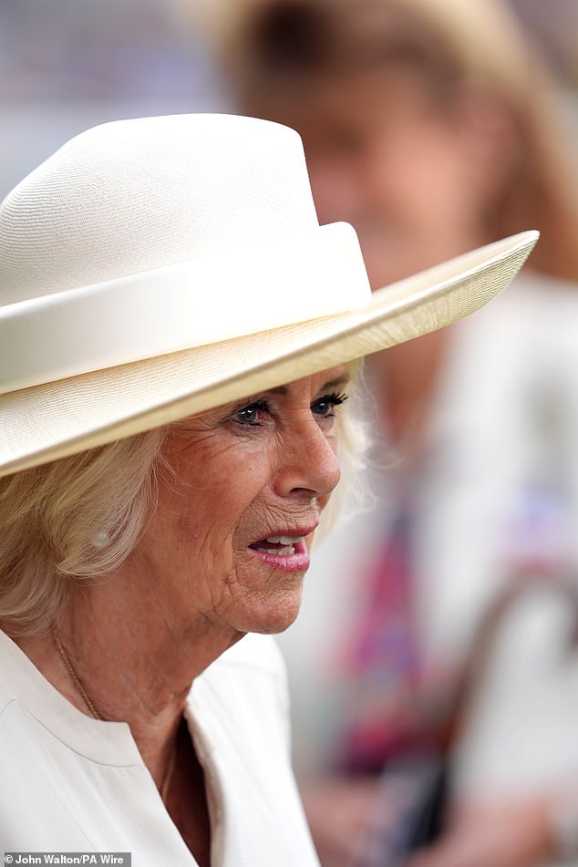 The royal opted for a monochrome look, in a tailored, off-white dress