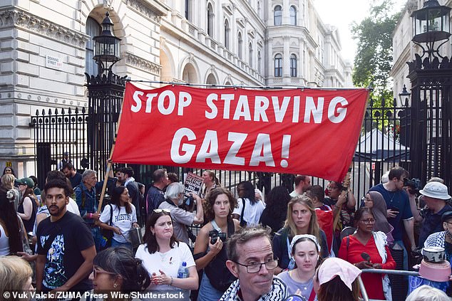 Protesters gathered outside Downing Street yesterday to urge Israel to 'stop starving Gaza'