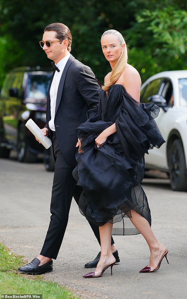 Guests wearing chic gowns and tailored suits began arriving to the lavish Cotswolds wedding at around 5pm this evening