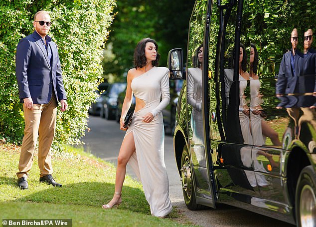 One guest wore a chic floor-length cream gown as she headed into the heiress's wedding ceremony