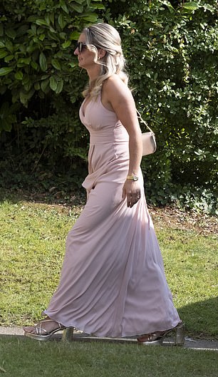 A stylish guest opted for a pastel pink dress, coupled with silver shoes