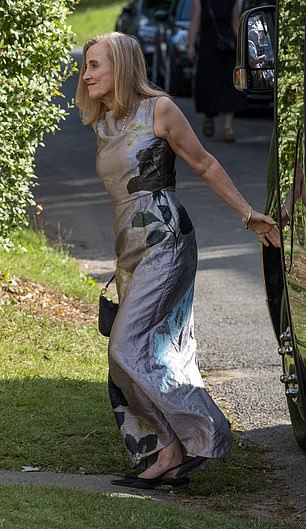 Another attendee sported a silver gown emblazoned with leafs with a matching handbag