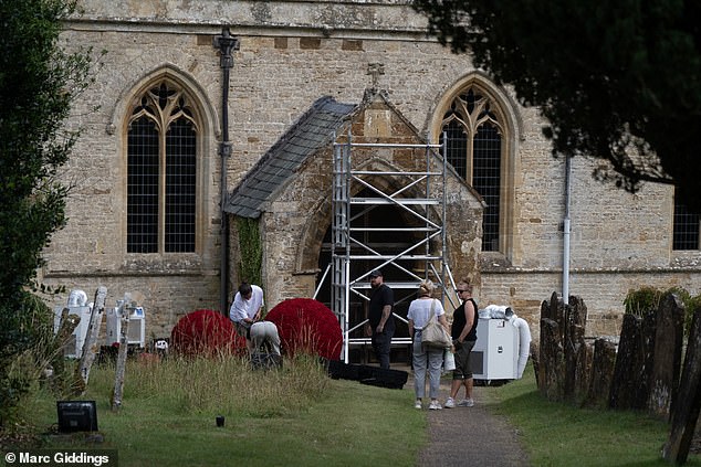 Workers preparing the church for the wedding of Eve Jobs and Harry Charles