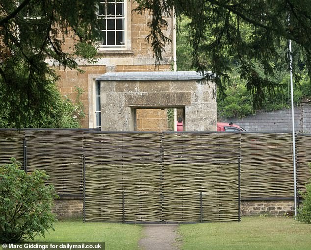 Screens have been erected around the perimeter of the church to give the wedding party privacy and prevent onlookers getting a look at the bride's dress before she said I do