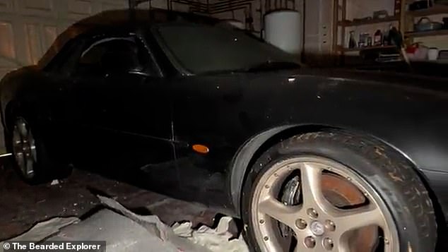 A black Jaguar sports car was left inside the mansion's garage