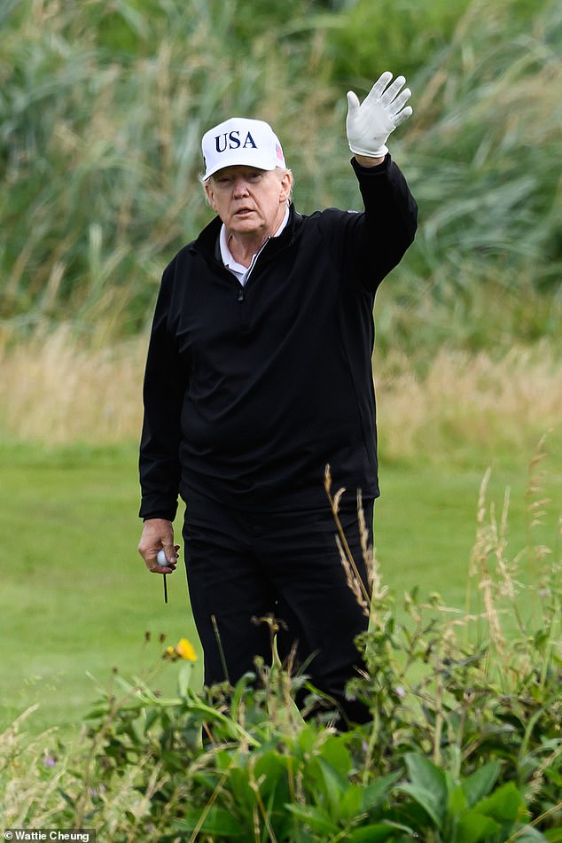 Mr Trump waved to onlookers as he played a round at his Turnberry golf course