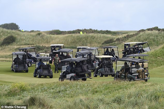 A huge entourage of 22 golf buggies accompanied Mr Trump during the outing