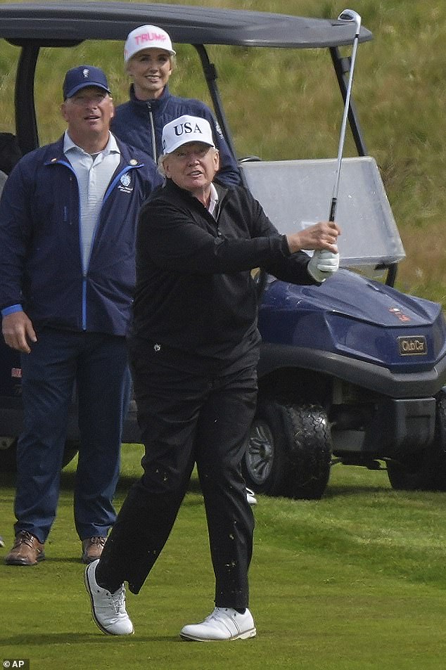 Members of Mr Trump's entourage watched on as he took his shots