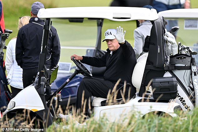 The US President waved a number of times as he was watched by onlookers
