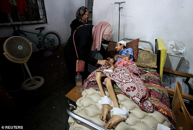 Palestinian boy Mosab Al-Debs, 14, who is malnourished according to medics, lies on a bed at Al-Shifa Hospital in Gaza City, July 22, 2025
