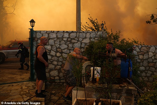But Fire Service spokesperson Vassilis Vathrakoyannis said 'the real difficulties are ahead of us'. Pictured: Wildfire in Kryoneri on Saturday