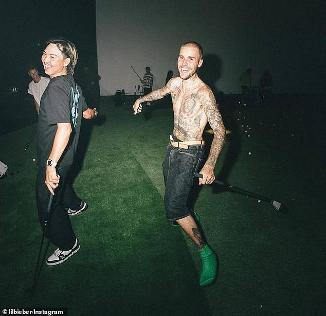 The tribute snap was at the end of a carousel that included a joyous and shirtless Justin practicing his golf swing at an indoor driving range with his wife Hailey, 28, and members of his crew