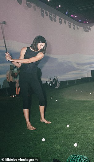 The Rhode founder's bestie, Kendall Jenner, 29, appeared in a couple of the photos, taking a swing on the artificial turf