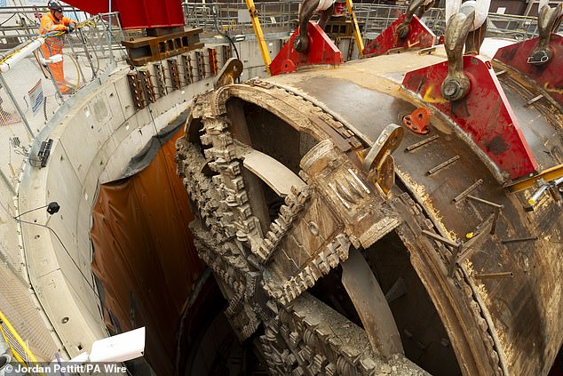 The huge metal device (pictured) has spent more than a year underground working on sections of the new high-speed rail network beneath the capital, finishing its project in June