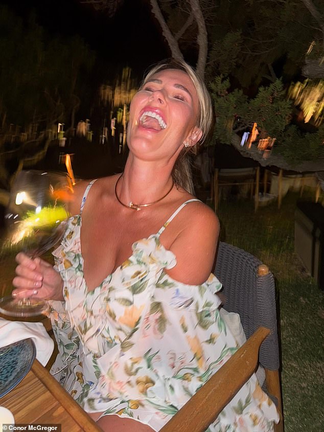 Dee looked radiant in a flowing floral-print dress