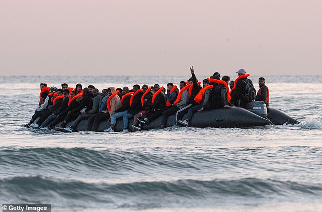 A group of migrants across the English channel on a dinghy on July 10