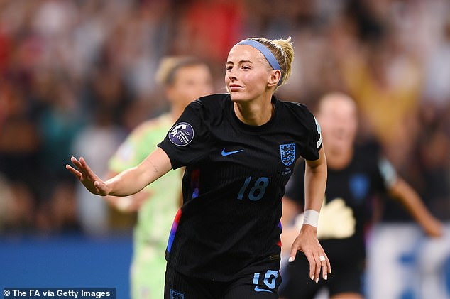 Chloe Kelly of England celebrates scoring her team's second goal from a rebound following a saved penalty in extra-time during the UEFA Women's EURO 2025 Semi-Final match between England and Italy