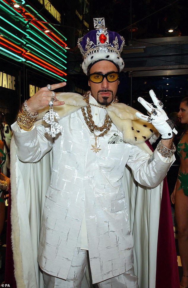 Dressed in a bold new look featuring a colourful crocheted rastacap, gold bling and trademark tinted shades, the actor was unmistakably back as the Staines-born MC
