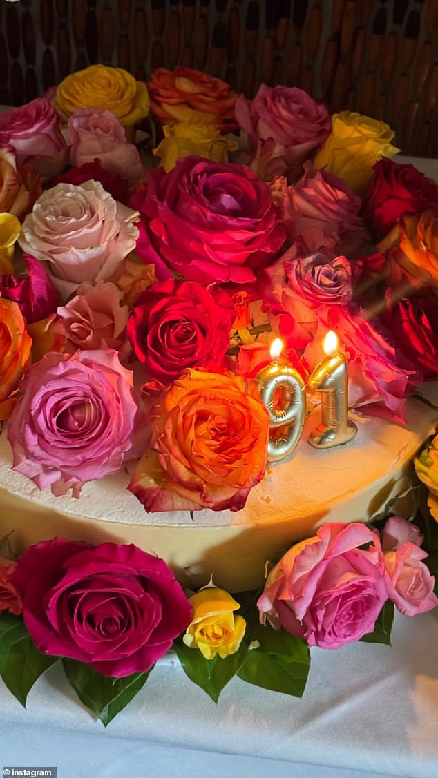 A up-close shot showed what looked like a classic cheesecake topped with golden, balloon-like '91' candles