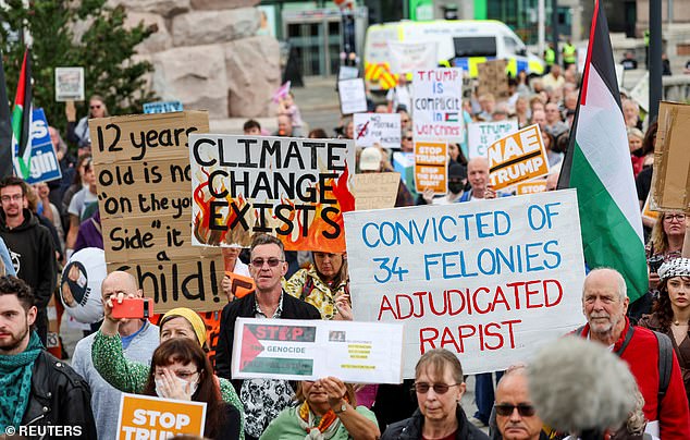 Anti-Trump demonstrators gather during a rally organized by the campaign group Stop Trump Coalition in Aberdeen, Scotland