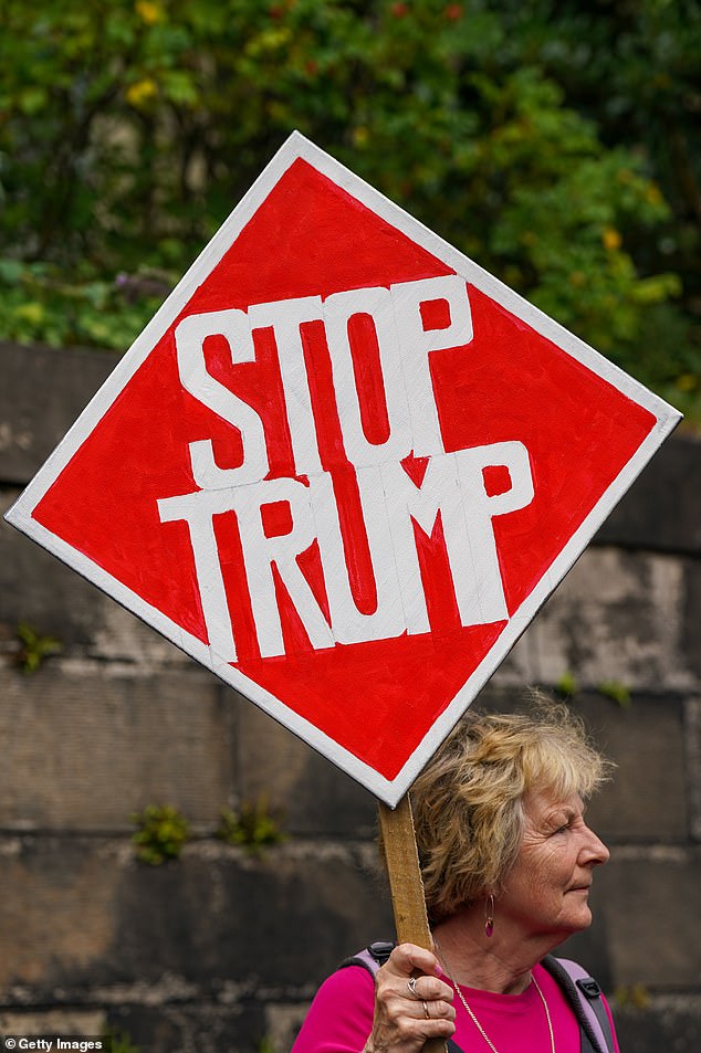 One woman held a 'Stop Trump' sign outside the office of the Consulate General of the United States in Edinburgh