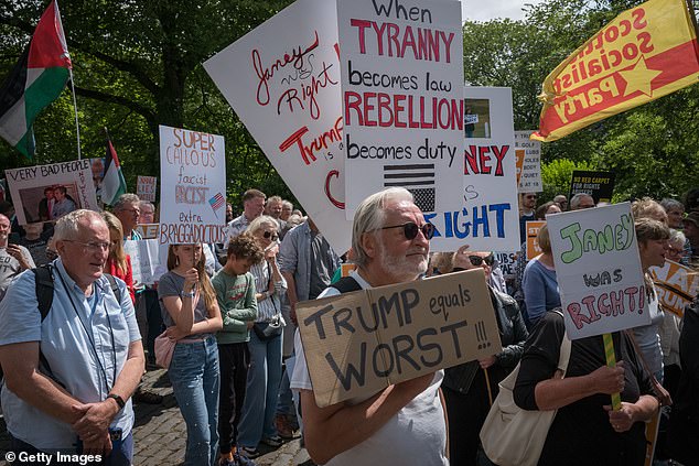 Hundreds of protestors gather outside the office of the Consulate General in Edinburgh, Scotland to protest the visit by Donald Trump