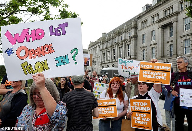 Many signs referenced Trump's status as a convicted felon - the first sitting president to do so