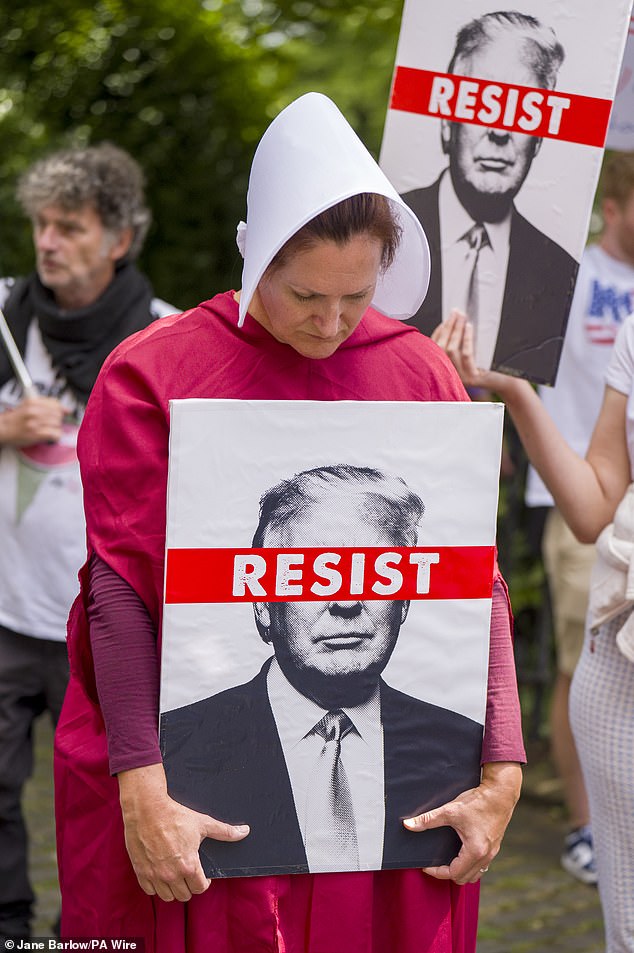 Several women dressed up as a character from The Handmaid's Tale in which women are second class citizens living under a dictatorship