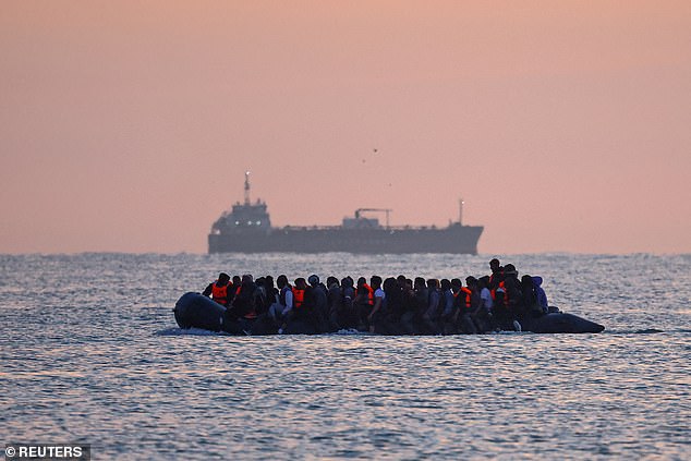 A group of migrants on an inflatable dinghy leave the coast of northern France in an attempt to cross the English Channel, July 17, 2025