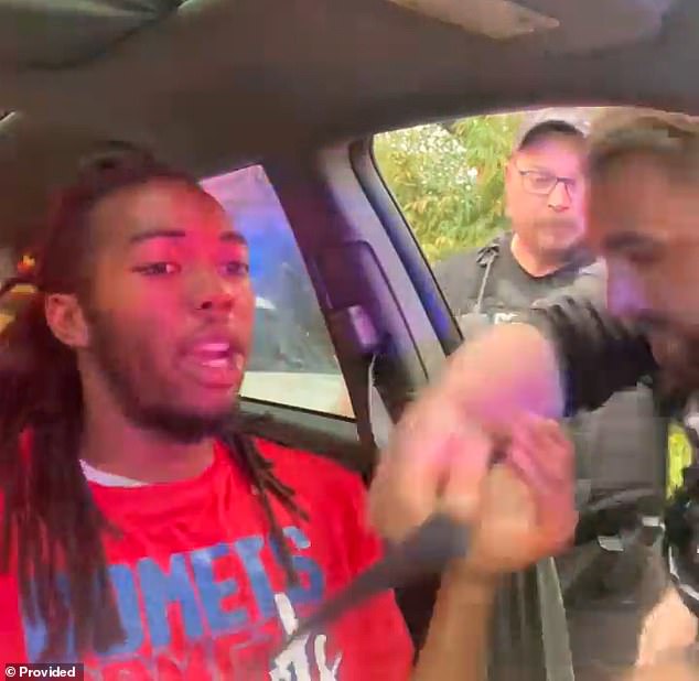 The video showed that McNeil was wearing a seatbelt and the officers actually had to unbuckle him - despite a police report claiming he was driving without wearing a seatbelt