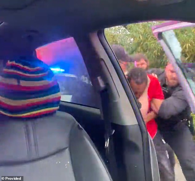 McNeil was punched again and after was pulled out of the car and told to stop talking while he tried to explain to cops that he was putting his hands behind his back