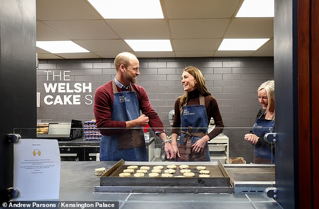 The Prince and Princess of Wales smile at each other during a visit to Pontypridd Market