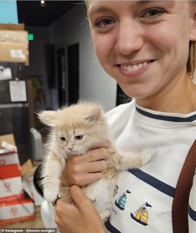 'Cat mum' Esme Morgan, 24, recently adopted a cat named Biscuit while in Washington