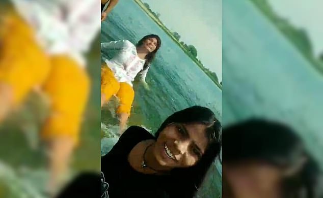 A group of girls smiled as they posed for a photo and filmed videos on their phones before drowning
