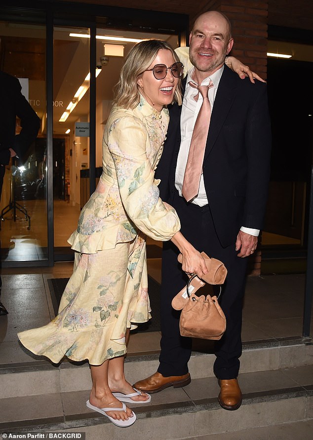 She looked gorgeous in a pale yellow dress and had changed into flip flops for the wedding party