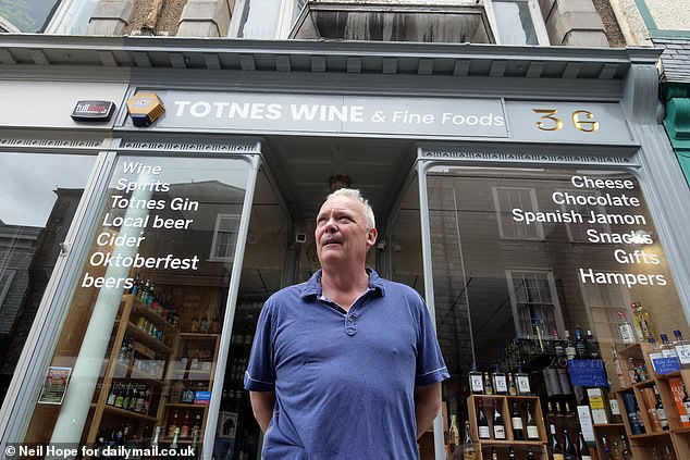 Simon Moorman, who owns Totnes Wine and Fine Foods, says visitors always tell him 'we wish our high street was like yours'